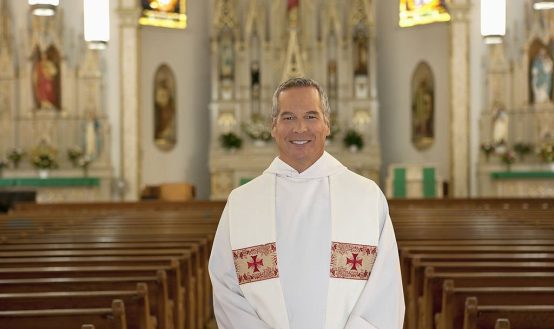 Why do priests wear white robes
